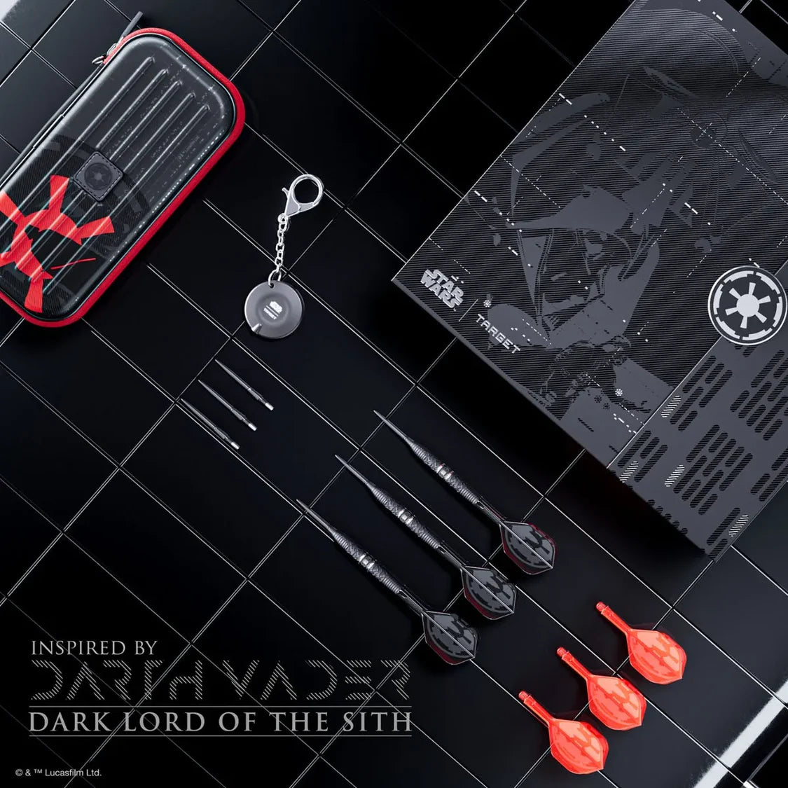 Collection of items inspired by Darth Vader, including darts and a keychain, on a dark surface.