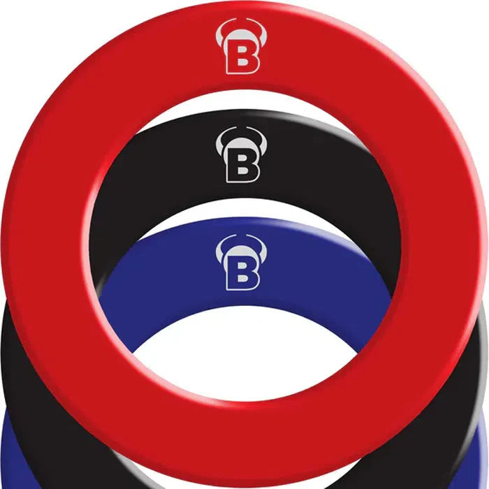 Top-down view of stacked dartboard surrounds in red, black, blue PU, showing color options and wall protection for dartboard setup