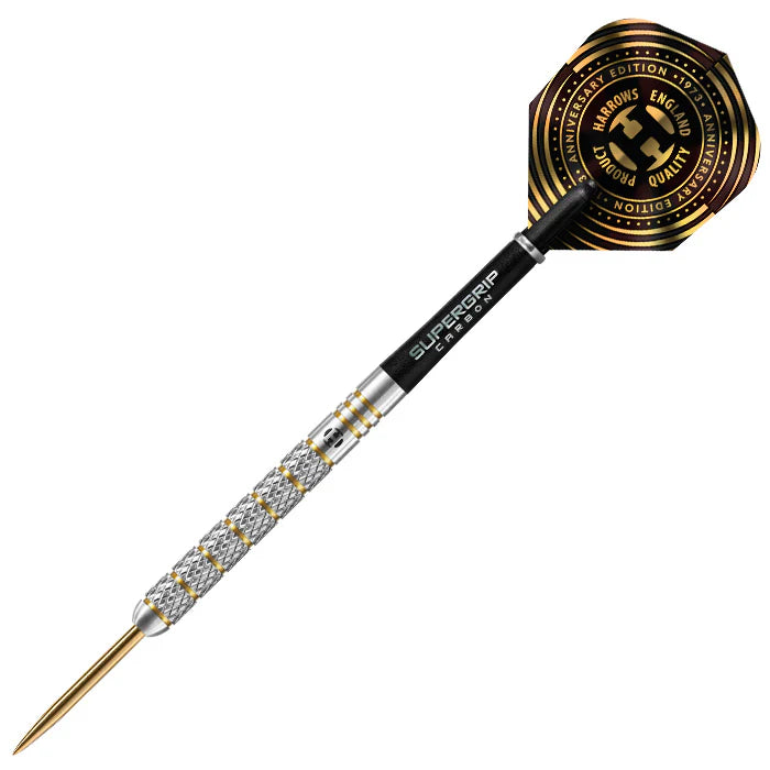 Tungsten dart with precision knurled grip, gold tip, Supergrip carbon shaft, and anniversary edition flight on white background