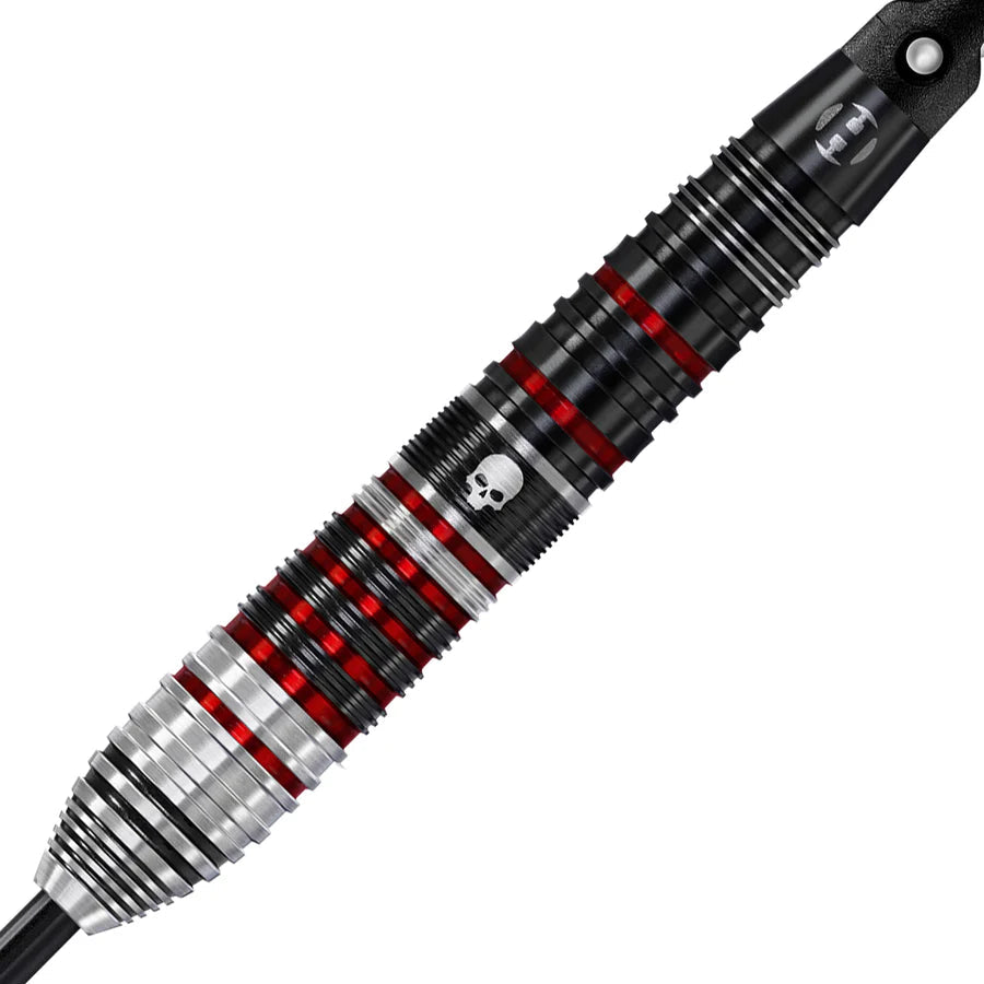 Macro close-up of tungsten dart barrel with black, silver, and red grooves and skull engraving, showing grip texture details.
