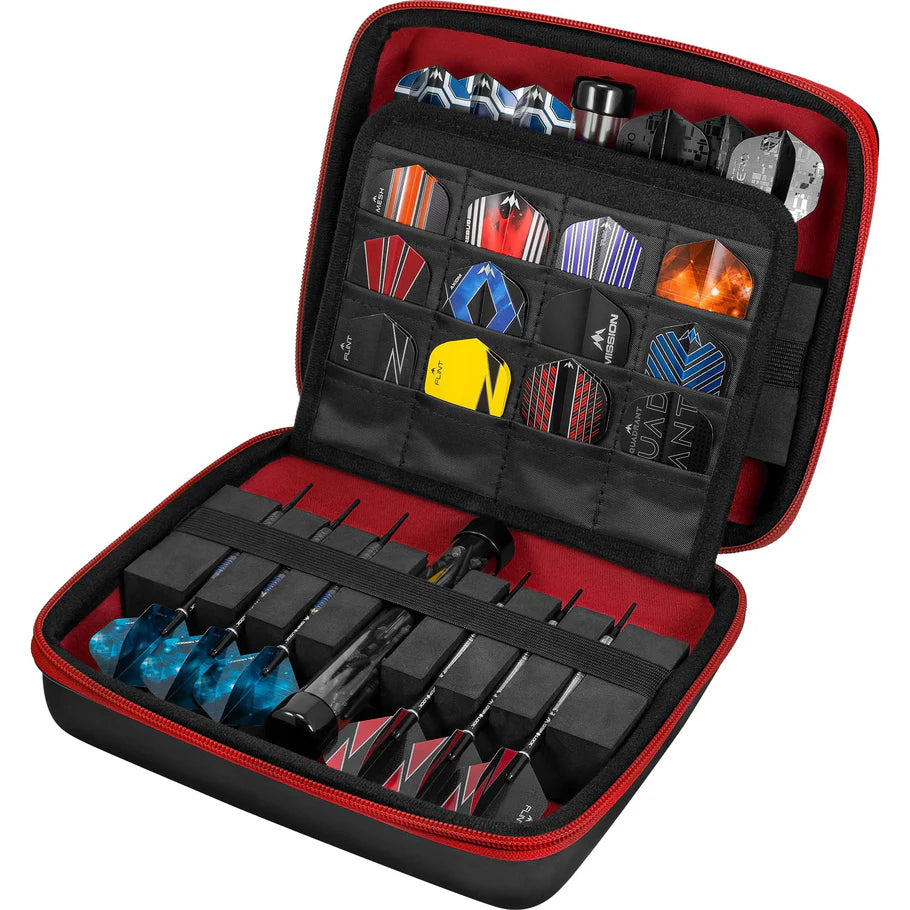 Open large red darts case with organized dart sets and assorted flight designs, angled view showing interior storage compartments