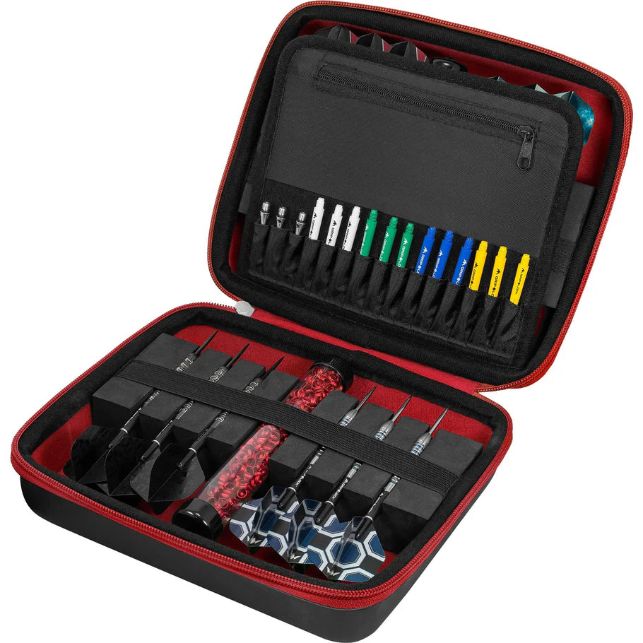 Open red darts case with organized darts, spare shafts, flights, and accessories in foam compartments, top-down angle