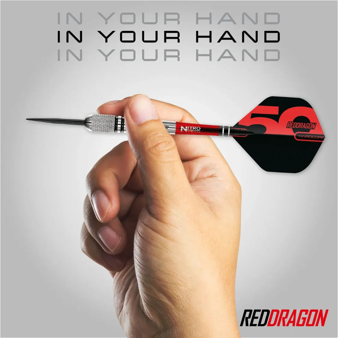 Torpedo 90 tungsten dart held in hand, showcasing knurled grip, front-loaded barrel, and red-black flight for dart players
