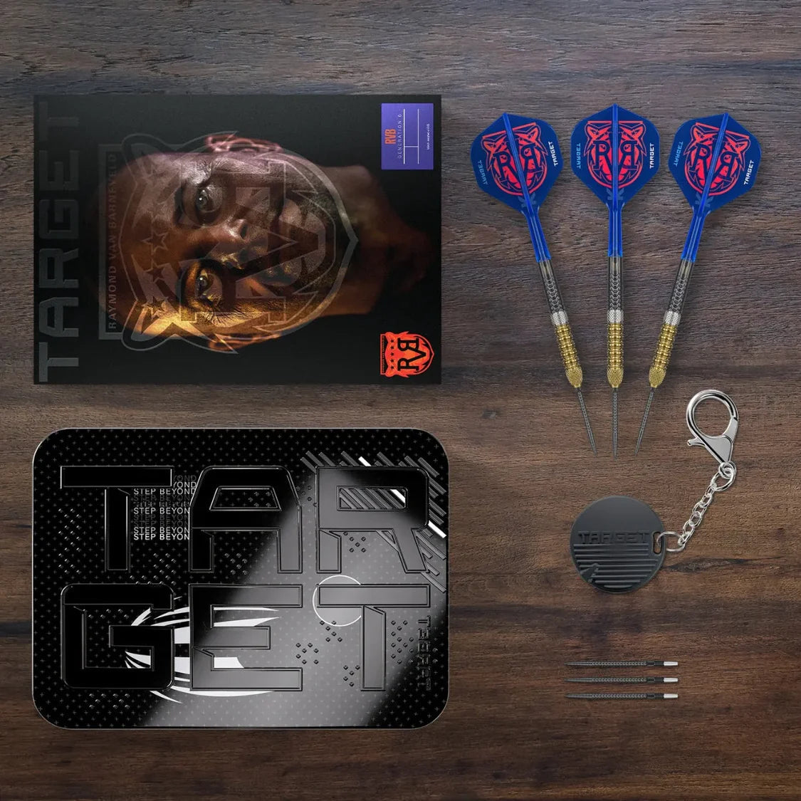Top-down view of G6 95% tungsten darts set showing three assembled darts, branded case, box, keychain, and replacement dart points