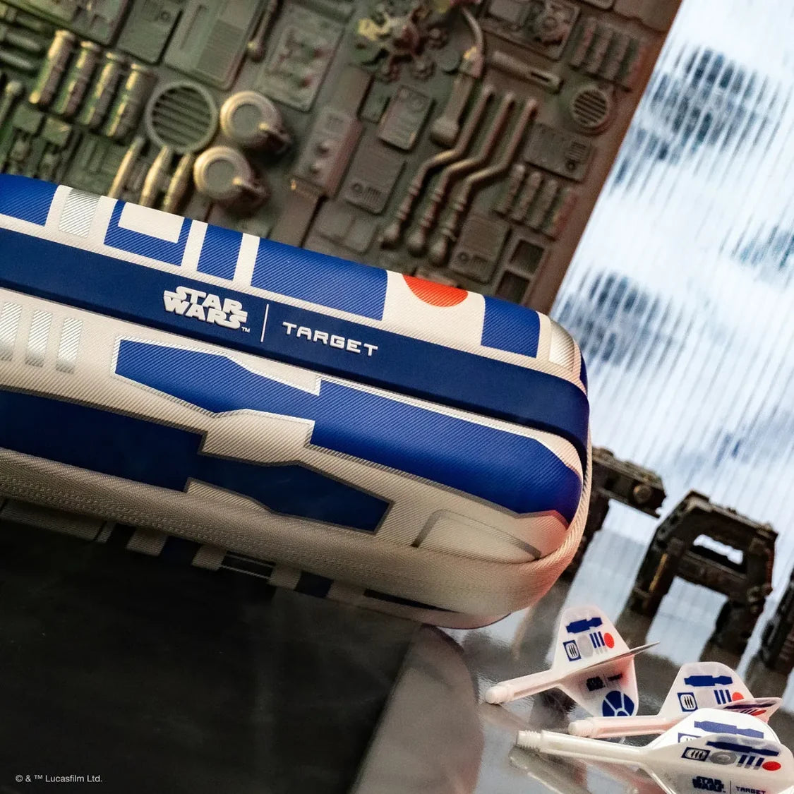 Angled lifestyle view of R2-D2 darts wallet with matching Star Wars dart flights shown on display for dart accessories collectors