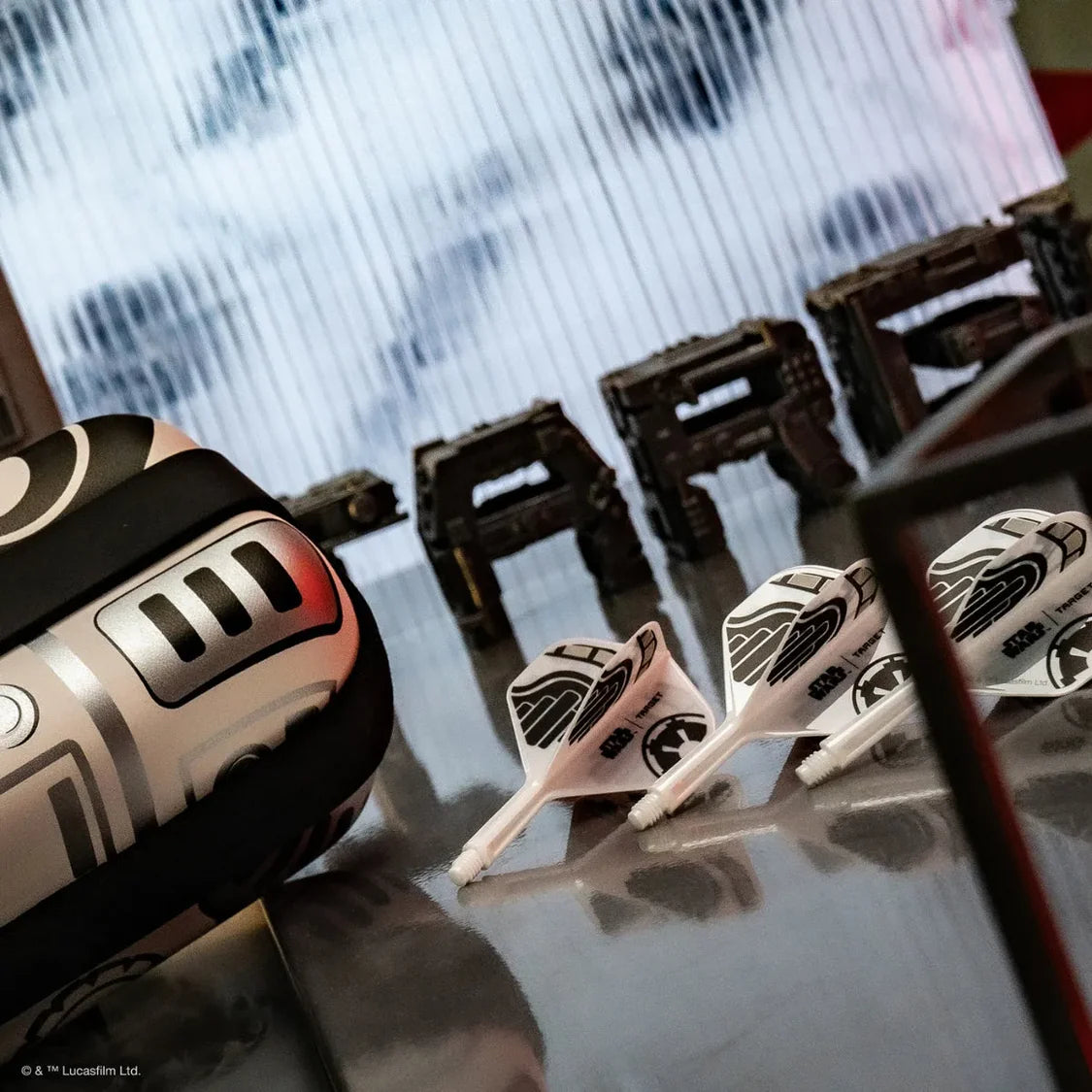 Angled close-up showing three Star Wars Stormtrooper dart flights and themed dart case, highlighting design details for darts enthusiasts