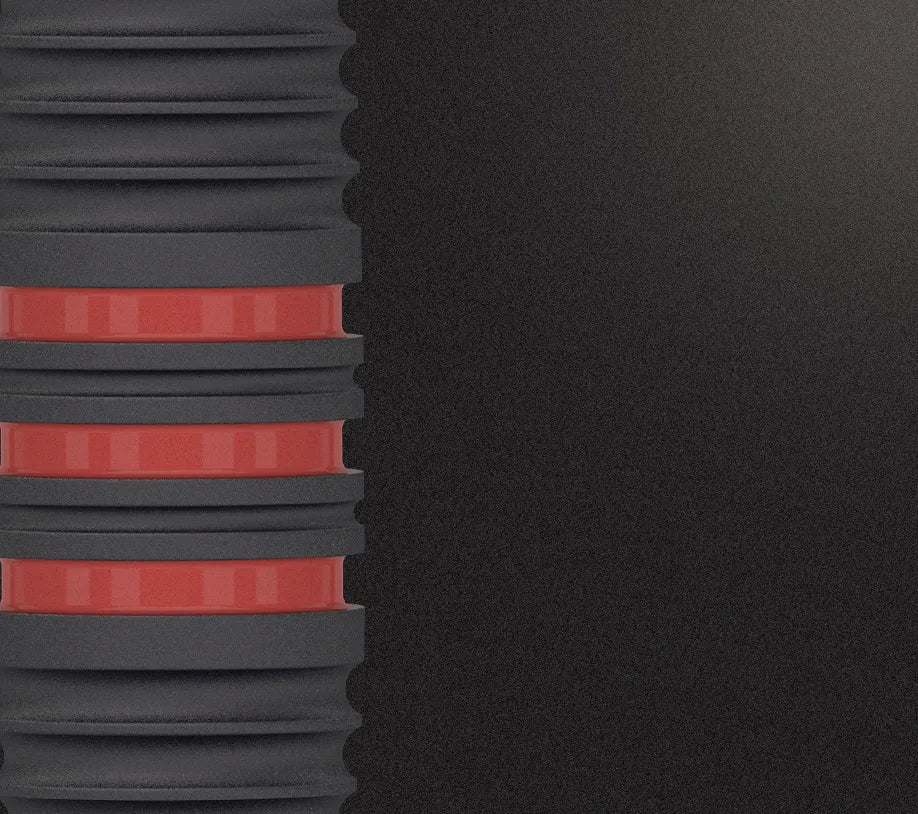macro shot of 80% tungsten dart barrel highlighting black radial grip grooves and red ring detail for enhanced control