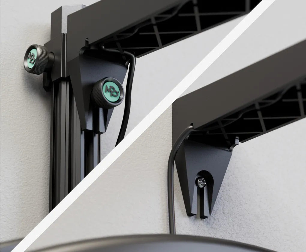 Close-up of dart camera system wall mounting brackets with adjustment knobs and cable management, hardware detail highlighted
