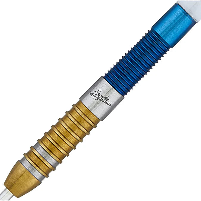 Close-up of 90 percent tungsten dart barrel with gold and blue PVD coating, deep grip rings, and signature engraving