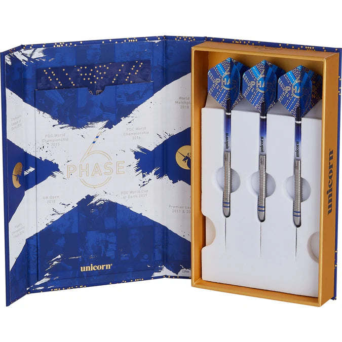 Three 90% tungsten darts with blue flights arranged in open display box, angled view showing detailed barrel grip and premium dart packaging.