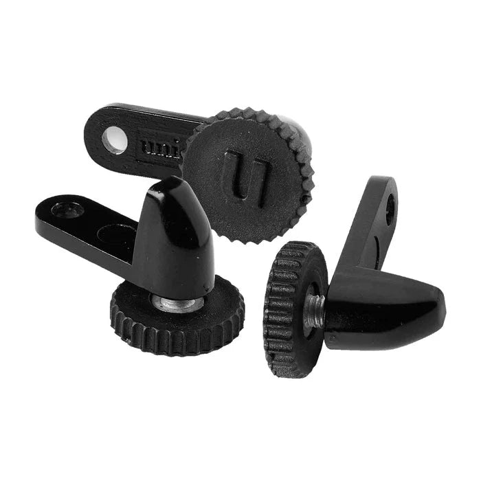 Three black dartboard locking system units isolated on white, showing textured grip wheels and mounting holes for secure dartboard installation