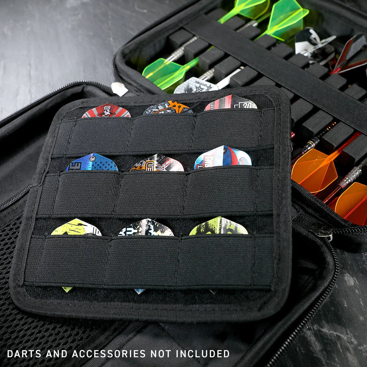 Angled close-up of open darts case showing organized storage for flights and darts, highlighting interior compartments and protective design
