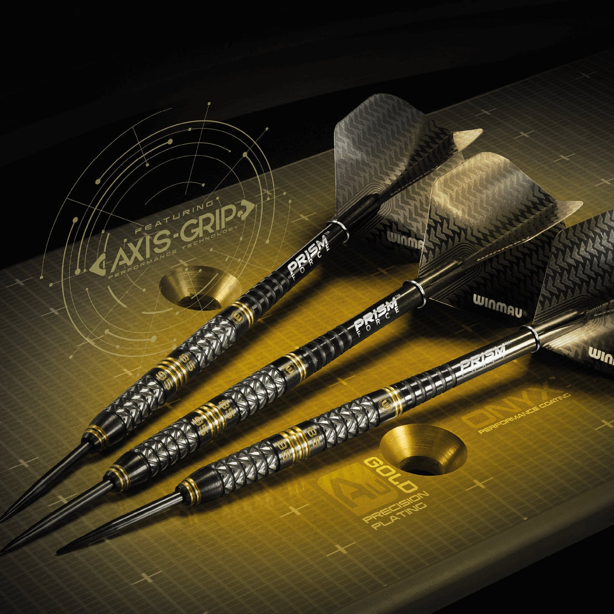 Three tungsten darts with black and gold dual core barrels, precision grip texture, and Prism Force flights arranged on a display surface