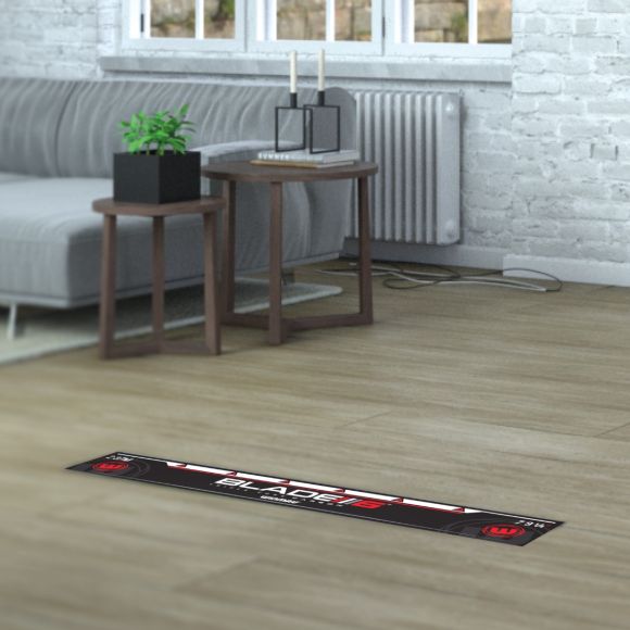 Blade 6 Oche Line dart throw line laid out on wood floor in living room, full view showing use for home dart setup