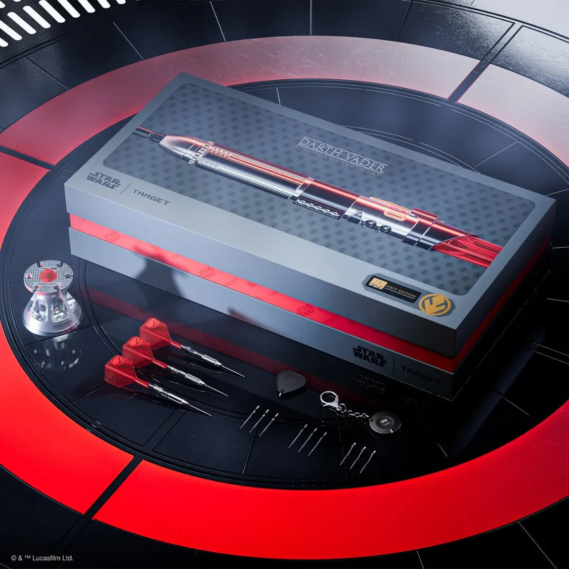 Dart set and a branded box on a red and black circular background