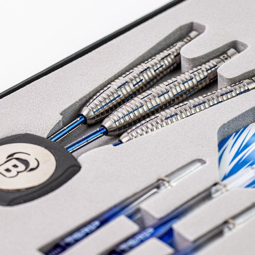 Angled close-up showing three 90% tungsten darts in display case, focus on detailed barrel grip and blue dart shafts