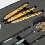 Close-up angled view of three 90% tungsten darts with gold grip barrels in foam packaging, showcasing Stingray ST3 dart barrel texture.