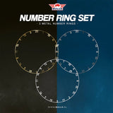 Top-down display of three metal dartboard number rings in gold, silver, and white, isolated and overlapping for dartboard customization