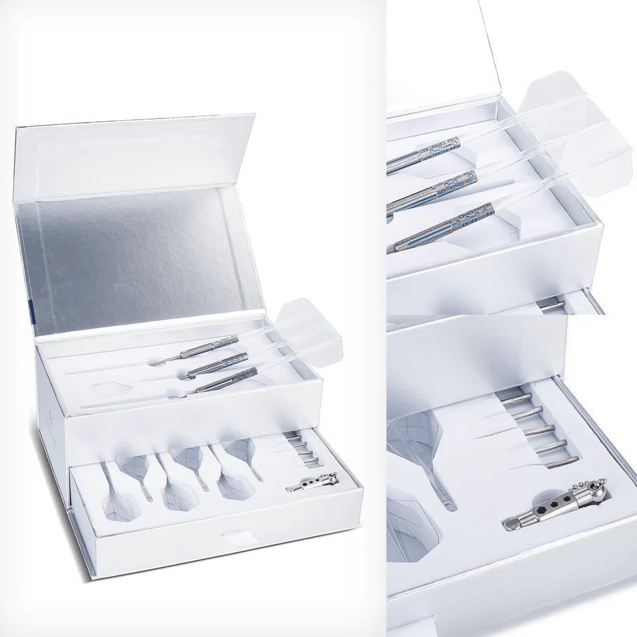Angled close-up of 95% tungsten darts set in luxury box with assembled darts, spare flights, shafts, and dart tool arranged for display