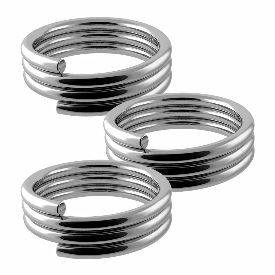 Three chrome spring O-rings for nylon dart shafts arranged close-up on white background, showing coiled structure for secure grip