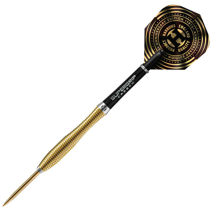 90% tungsten dart full view on white, featuring gold knurled barrel, black carbon shaft, anniversary gold-black flight