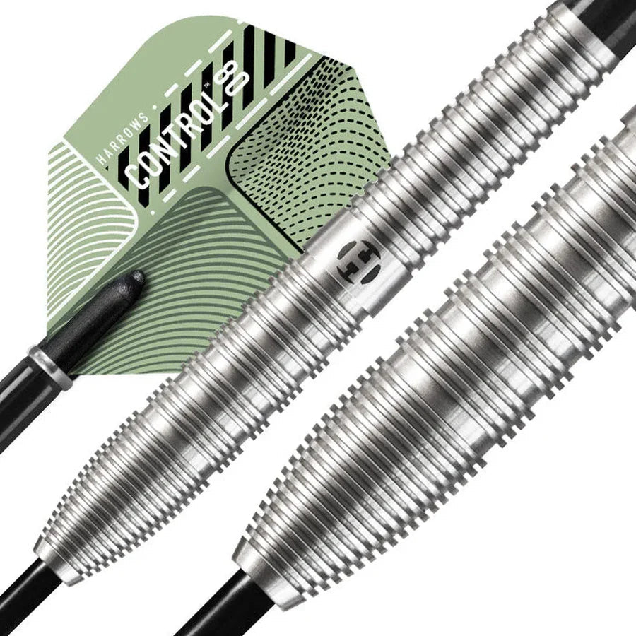 Macro close-up of tungsten darts showing detailed ring grip, tapered barrels, and green textured flight for advanced dart control