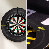 Harrows Fortis dartboard surround on the wall in a home darts setup