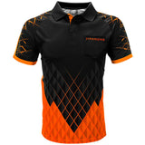 Full front view of Paragon darts shirt with bold orange and black geometric pattern, short sleeves, and pocket, isolated on white background