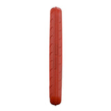 Side profile of slim red darts case with textured grooves, isolated on white background, showing compact dart equipment storage