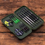 Top-down view of open darts case with six assembled darts, extra shafts, and flights organized on rustic wood background