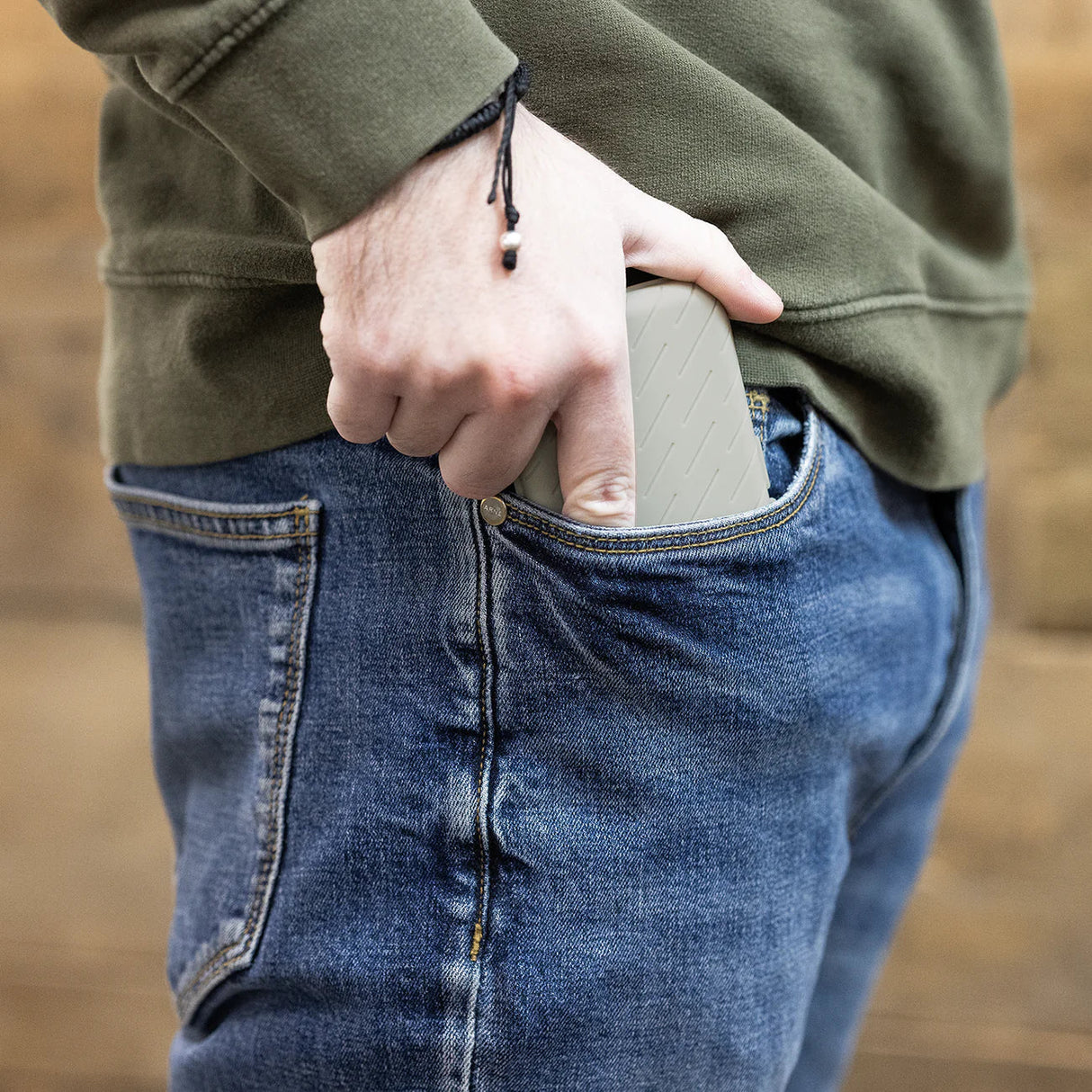 Slim darts case fits easily in jeans pocket, showcasing portable dart accessory storage for players on the go