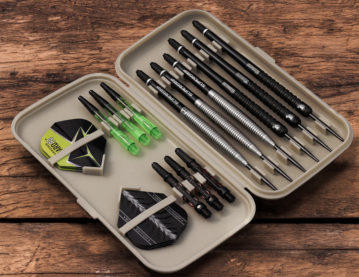 Open darts case top-down view with six assembled darts, spare shafts, and flights organized for dart storage and accessory protection