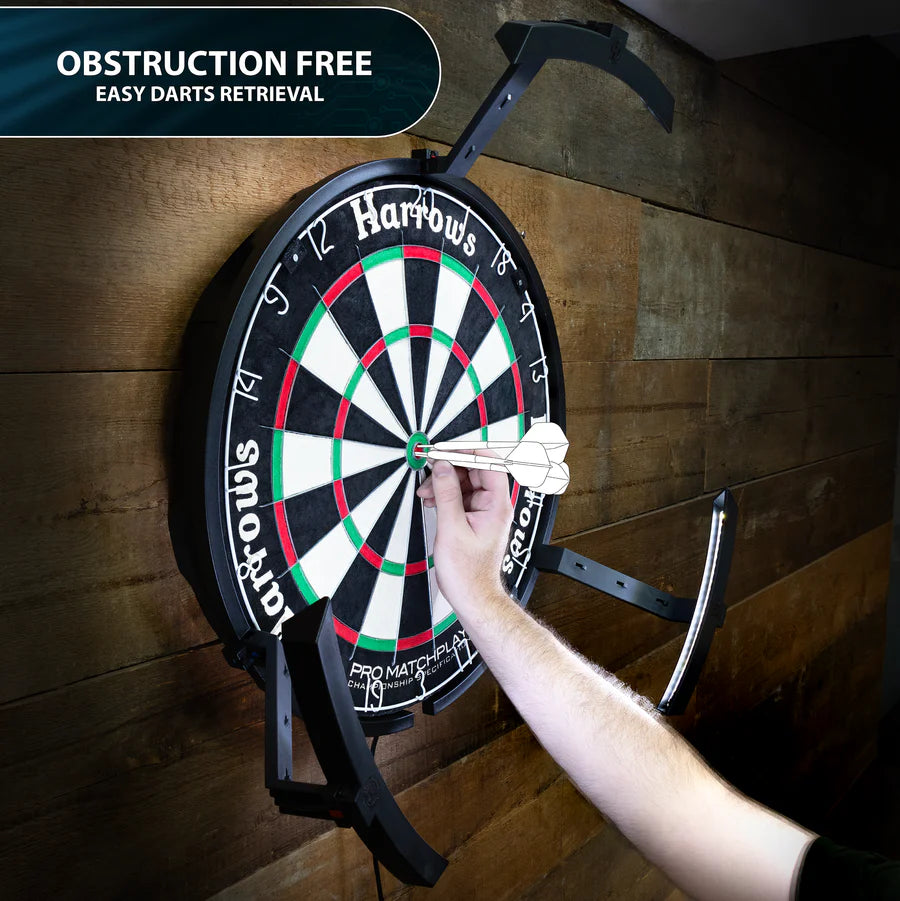 User retrieving darts from a wall-mounted dartboard with Trilight dartboard lighting, obstruction-free easy darts removal displayed