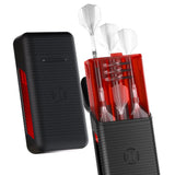 Angled view of red and black dart case, one closed and one open holding assembled darts and spare dart accessories