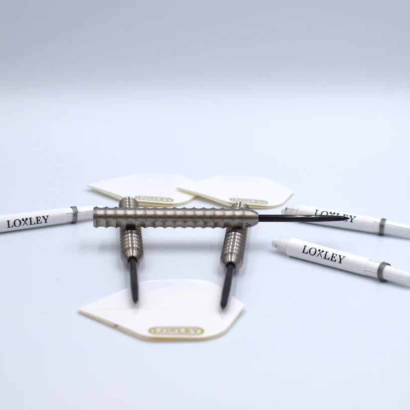 Angled close-up of three tungsten dart barrels with aggressive shark grip, separate white shafts and flights, isolated on white background