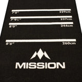 Close-up angled view of darts mat showing oche distance markings in inches and centimeters for dartboard setup