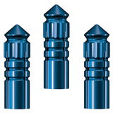 Close-up of three blue aluminum dart flight protectors with grooved design on white background