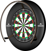 Angled view of dartboard lighting ring with bright white LEDs fully illuminating a mounted dartboard, ideal for dart setup