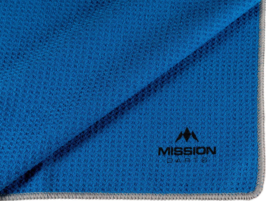 Close-up angled view of blue waffle hand towel with textured weave and Mission Darts logo, ideal for dart grip moisture control