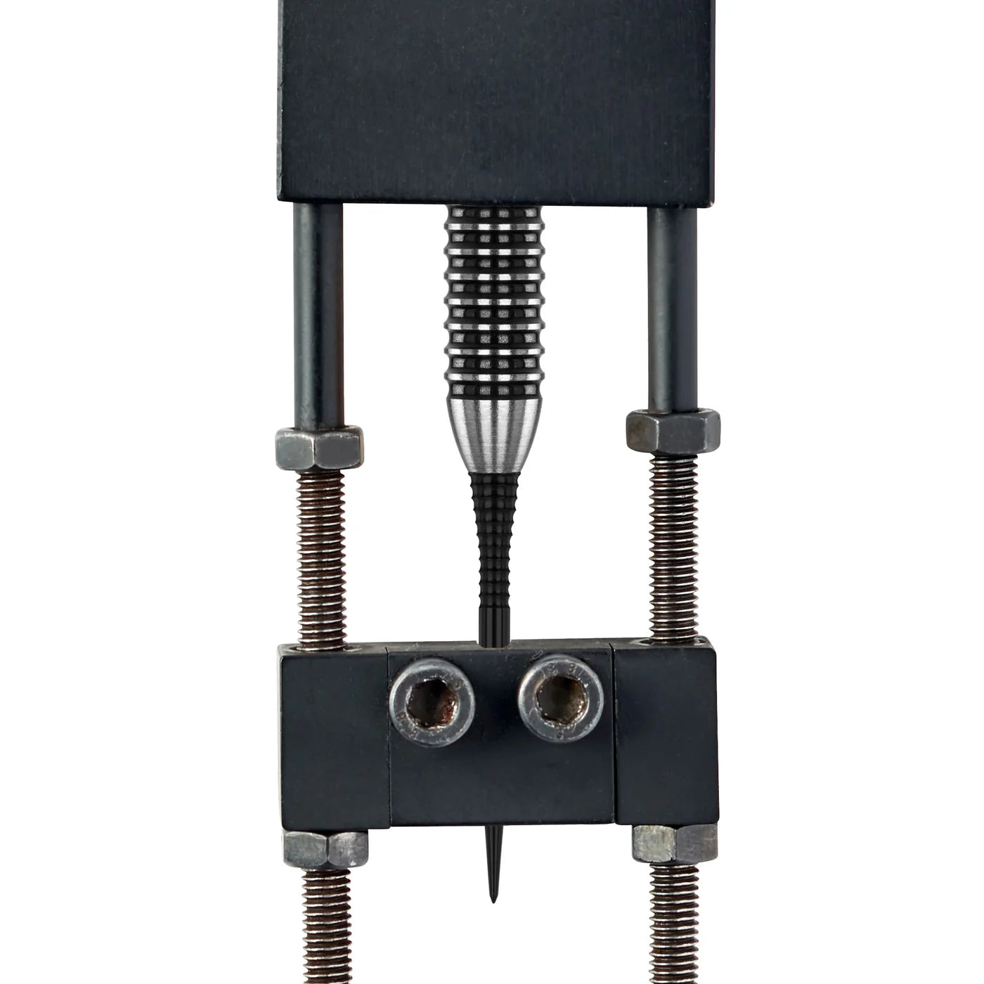 Macro view of dart point secured in calipers, showing GT grip texture and spearhead profiling with scale reference for dart accessory buyers