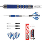 Flat lay of 90% tungsten darts set with blue ring grip, extra shafts, blue flights, and retail packaging, isolated on white background