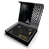 Anniversary tungsten darts gift set in open box with three darts, GVV flights, stems, and accessories on black foam display