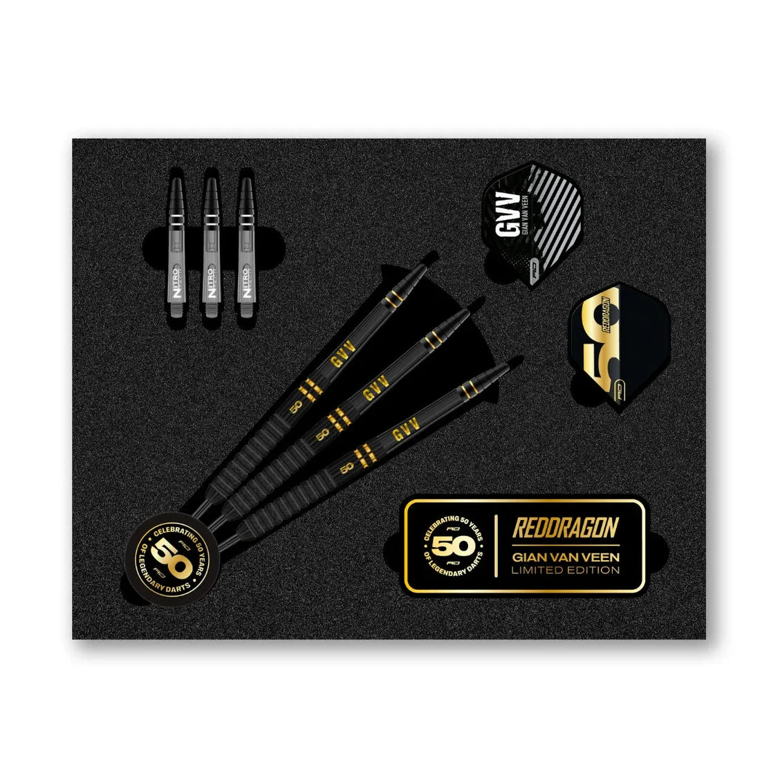 Top-down view of Gian Van Veen 50 Year Limited Edition 90% tungsten darts set in packaging with three assembled darts, spare black stems, flights, and anniversary badge.