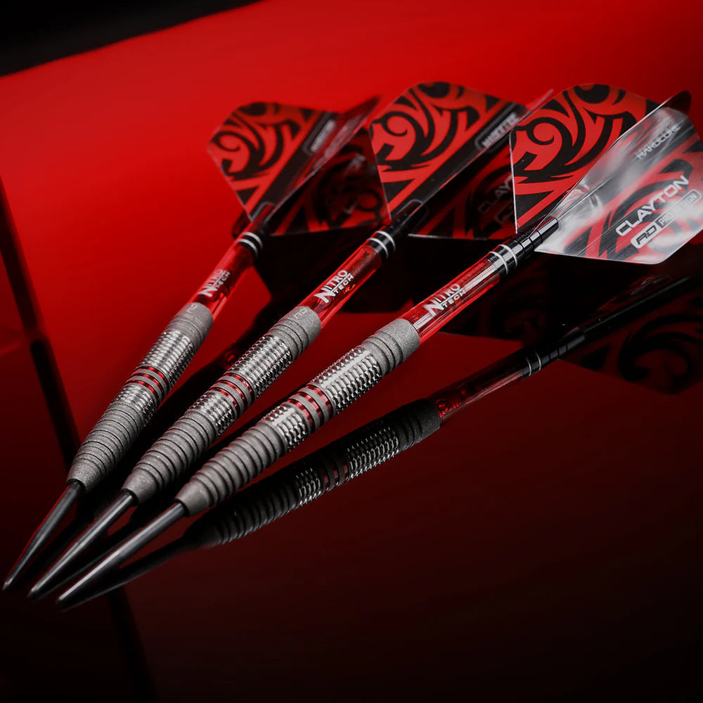 angled close-up of three 90% tungsten darts with patterned flights, detailed barrel grip, red accents on black reflective surface