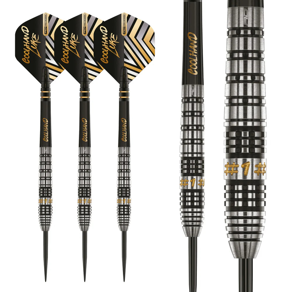 Three 90% tungsten darts upright with black and gold flights, detailed close-up of ringed barrel grip and gold #1 engraving, isolated on white