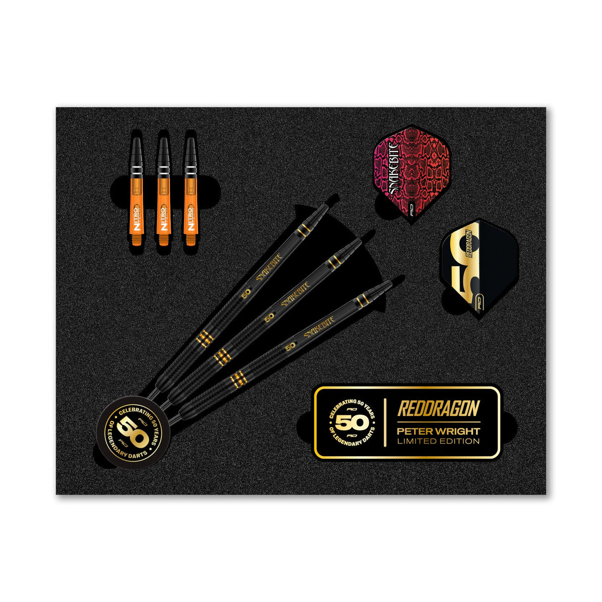 Top-down display of 90% tungsten Peter Wright 50 Year Anniversary darts set with three black darts, spare shafts, flights, and commemorative badge