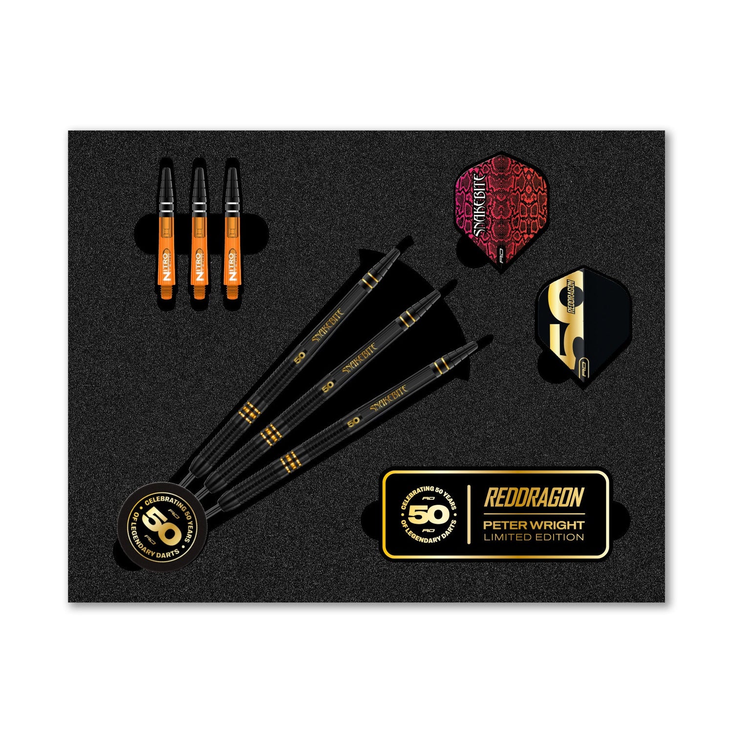 Top-down display of 90% tungsten Peter Wright 50 Year Anniversary darts set with three black darts, spare shafts, flights, and commemorative badge