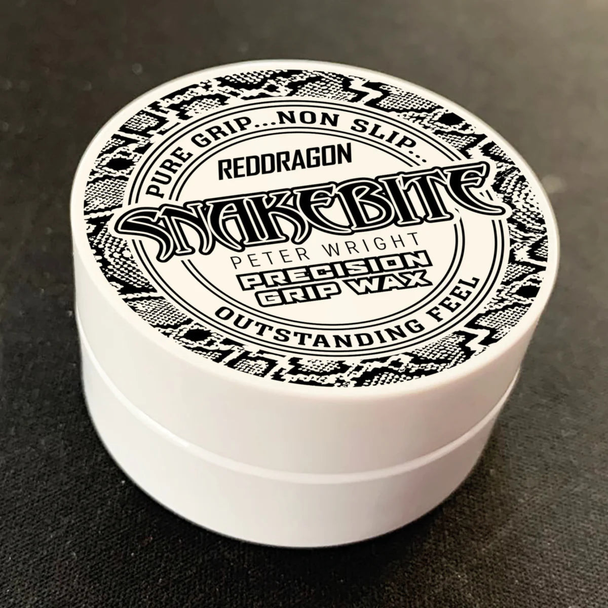 Angled close-up of Snakebite Peter Wright precision grip wax tub in packaging, lid design visible for dart grip enhancement