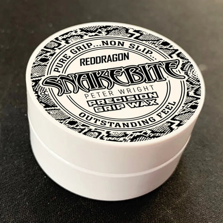 Angled close-up of Snakebite Peter Wright precision grip wax tub in packaging, lid design visible for dart grip enhancement