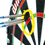 Close-up angled view of three steel tip darts grouped inside a yellow practice ring on a dartboard for precision aiming practice